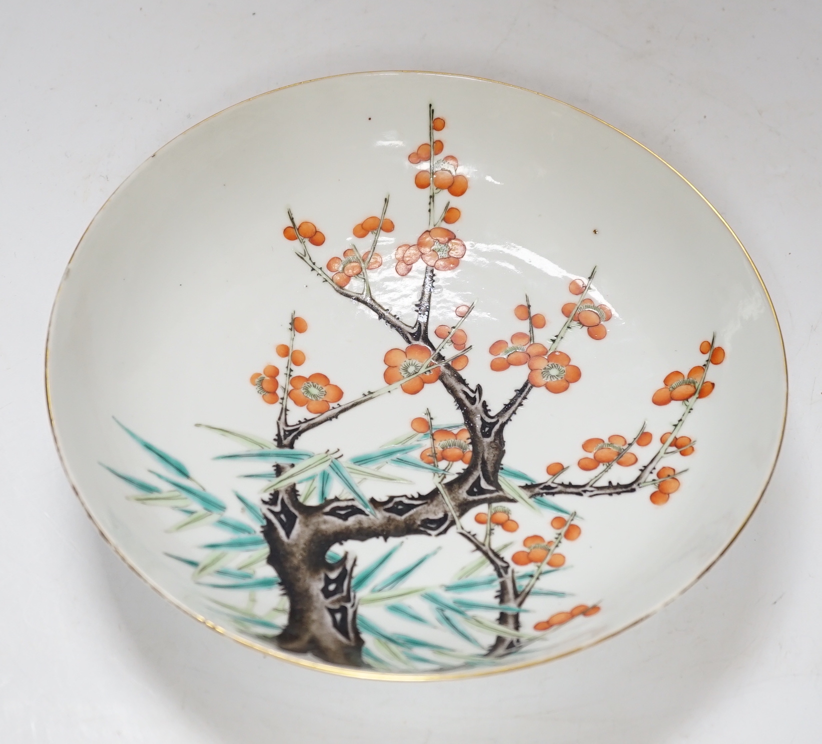 A Chinese enamelled porcelain ‘prunus’ saucer dish, Guangxu six character mark and of the period (1875-1908), 21cm diameter